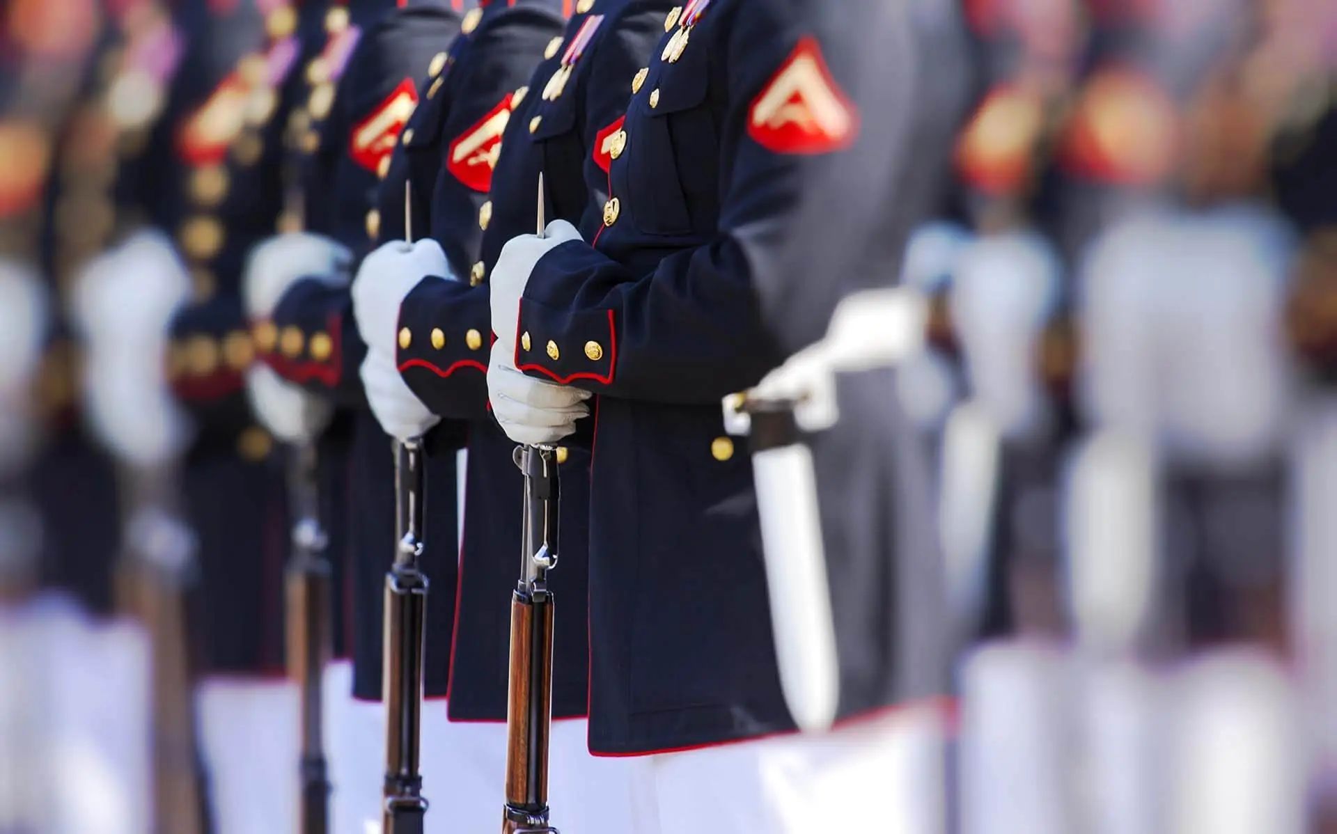 Marines in dress blue uniforms standing in formation